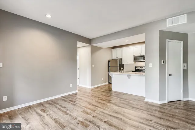 a view of kitchen with wooden floor