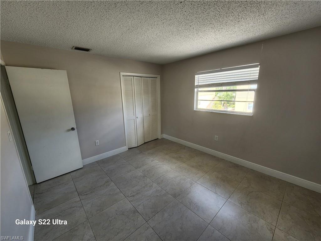 3325 Airport Road North, Unit N8 Naples, FL 34105 - Photo 17 of 22 an empty room with windows