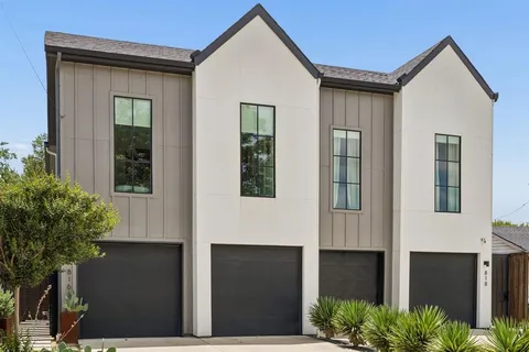 a front view of a house with garage