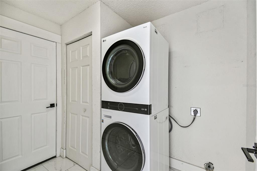 2222 Champlain Avenue Spring Hill, FL 34609 - Photo 13 of 74 a utility room with dryer and washer