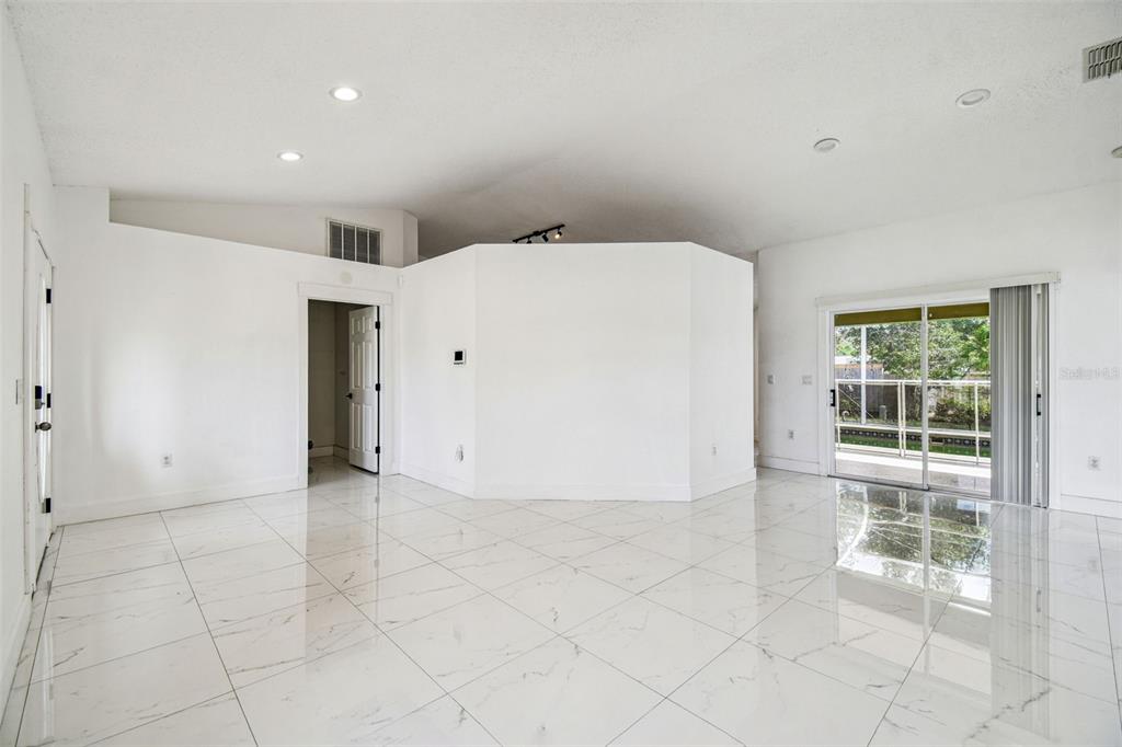 2222 Champlain Avenue Spring Hill, FL 34609 - Photo 14 of 74 an empty room with windows