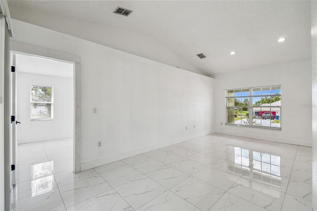2222 Champlain Avenue Spring Hill, FL 34609 - Photo 16 of 74 a view of an empty room with a window
