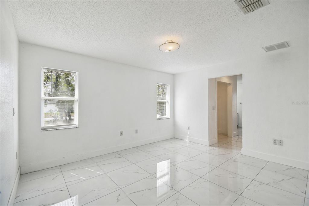 2222 Champlain Avenue Spring Hill, FL 34609 - Photo 17 of 74 an empty room with windows
