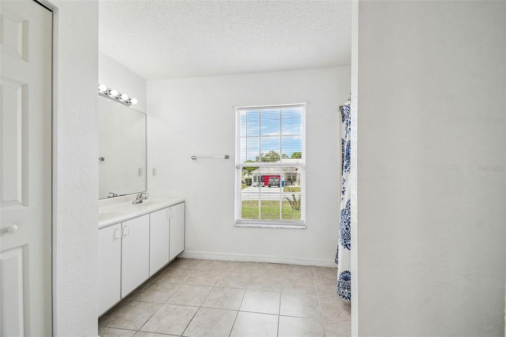 2222 Champlain Avenue Spring Hill, FL 34609 - Photo 23 of 74 a view of an empty room with a window