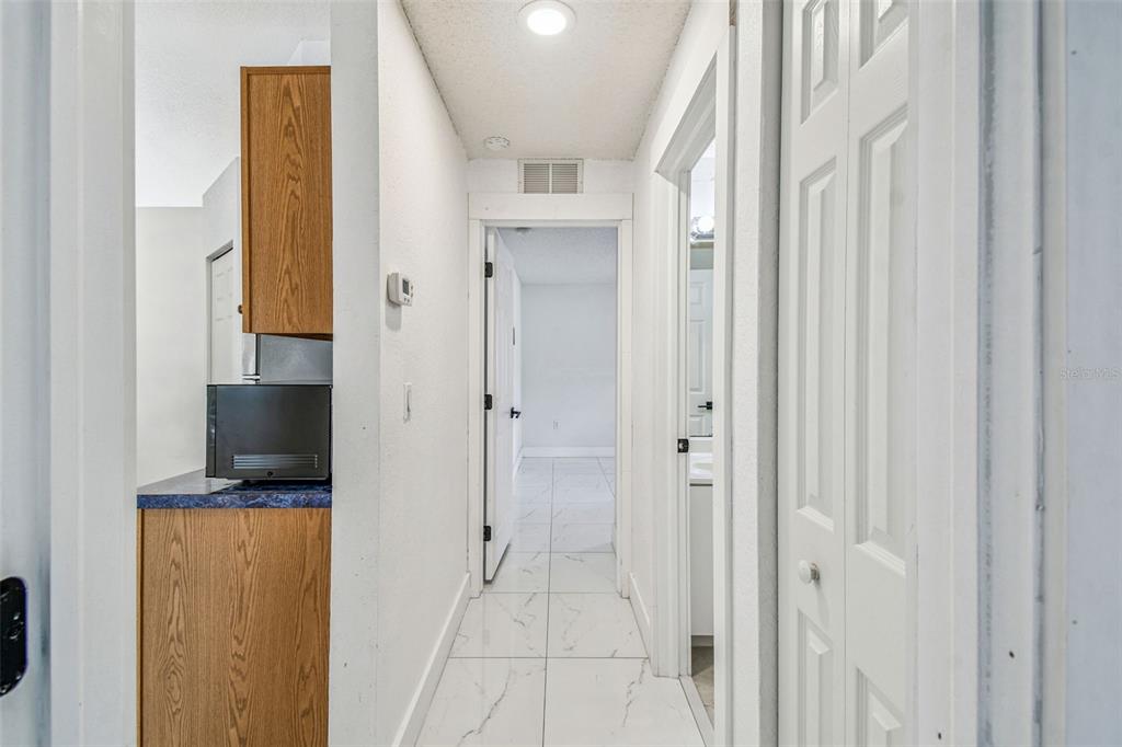 2222 Champlain Avenue Spring Hill, FL 34609 - Photo 37 of 74 a bathroom with a granite countertop sink and a mirror