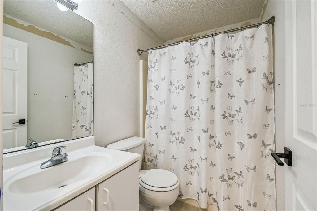 2222 Champlain Avenue Spring Hill, FL 34609 - Photo 41 of 74 a bathroom with a sink toilet and shower