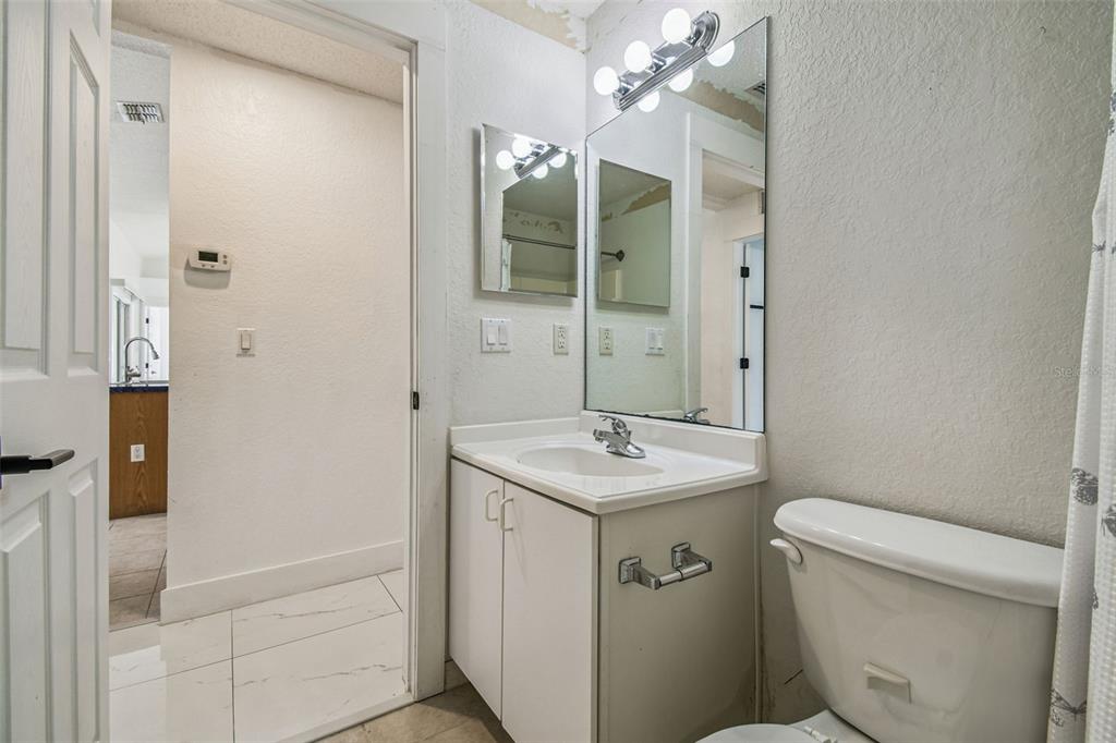 2222 Champlain Avenue Spring Hill, FL 34609 - Photo 42 of 74 a bathroom with a sink a toilet and shower