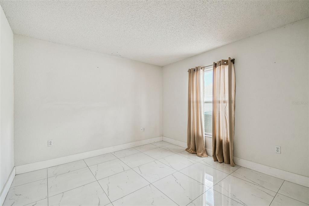 2222 Champlain Avenue Spring Hill, FL 34609 - Photo 43 of 74 an empty room with windows