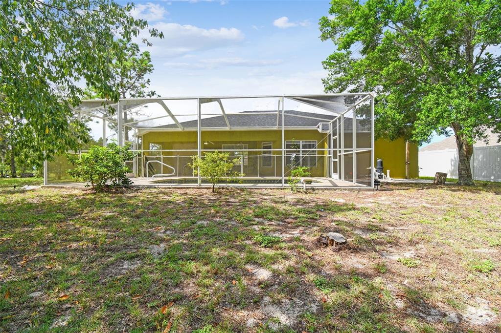 2222 Champlain Avenue Spring Hill, FL 34609 - Photo 51 of 74 a view of a house with a yard