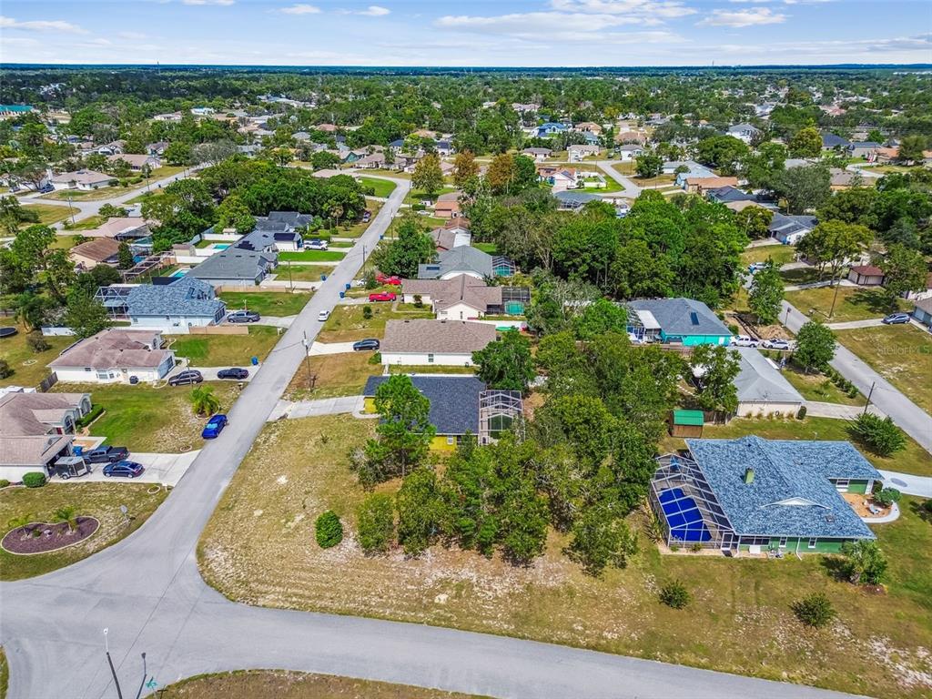 2222 Champlain Avenue Spring Hill, FL 34609 - Photo 66 of 74 an aerial view of a house with a yard