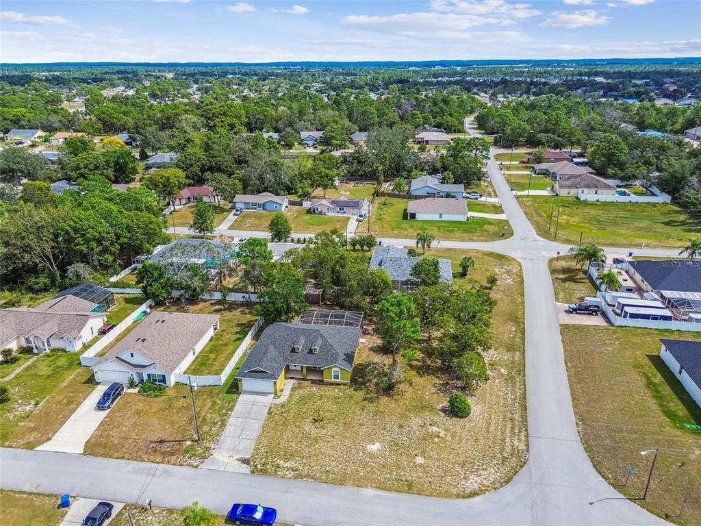 2222 Champlain Avenue Spring Hill, FL 34609 - Photo 67 of 74 an aerial view of a house with a swimming pool