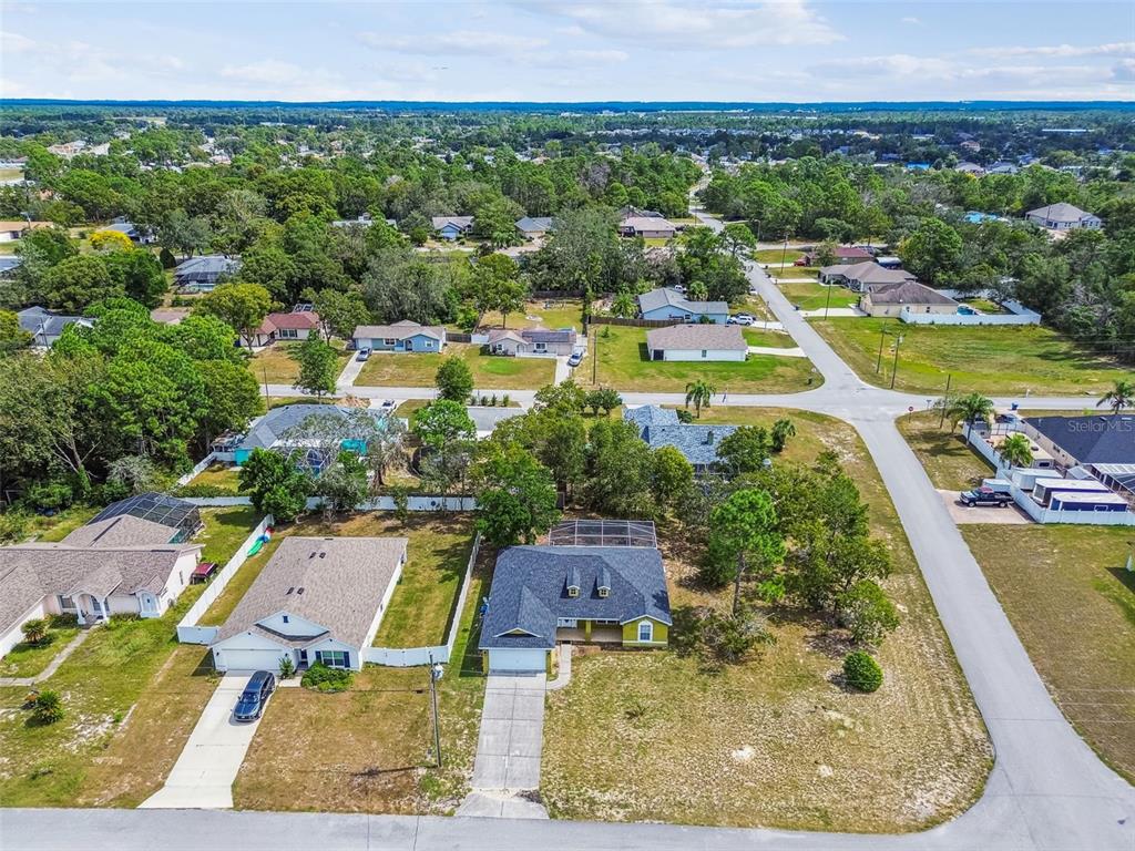 2222 Champlain Avenue Spring Hill, FL 34609 - Photo 68 of 74 an aerial view of residential houses with outdoor space and swimming pool
