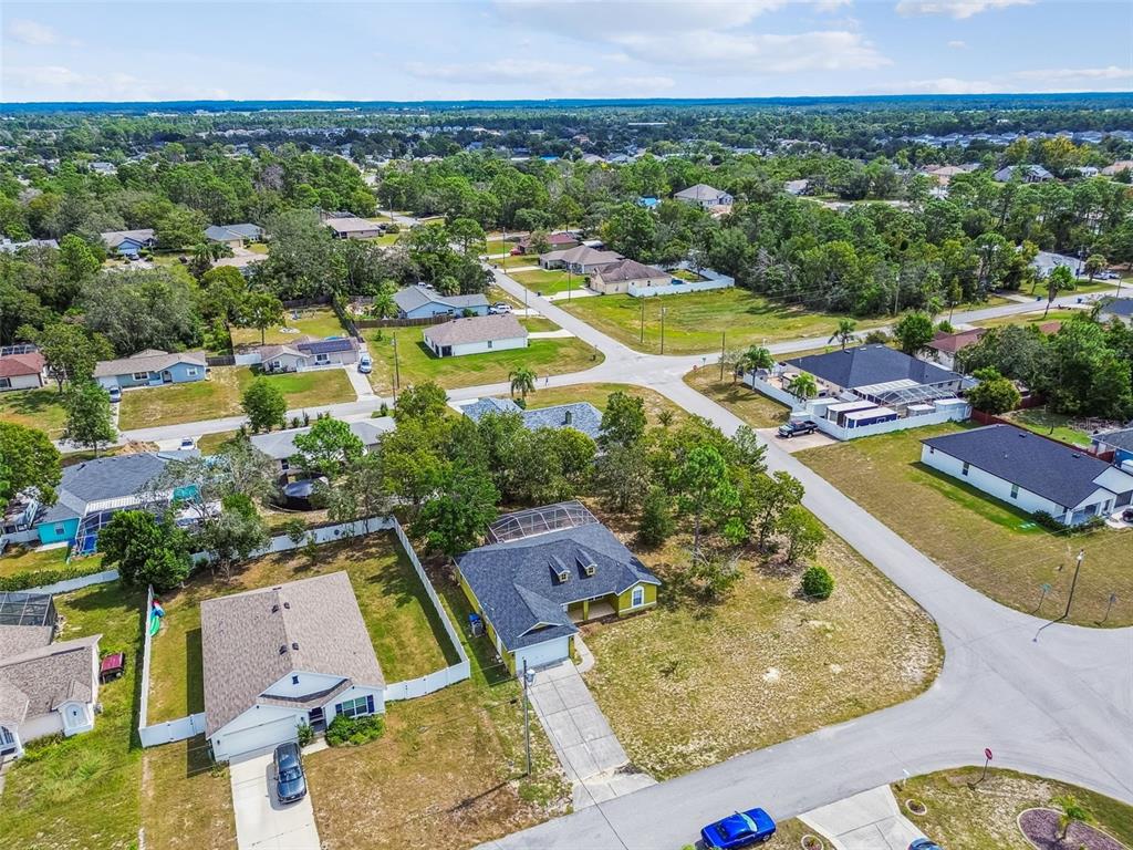 2222 Champlain Avenue Spring Hill, FL 34609 - Photo 69 of 74 an aerial view of residential houses with outdoor space and swimming pool