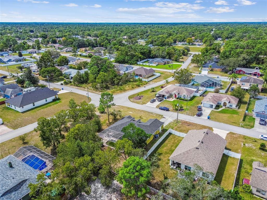 2222 Champlain Avenue Spring Hill, FL 34609 - Photo 72 of 74 an aerial view of residential houses with outdoor space and swimming pool