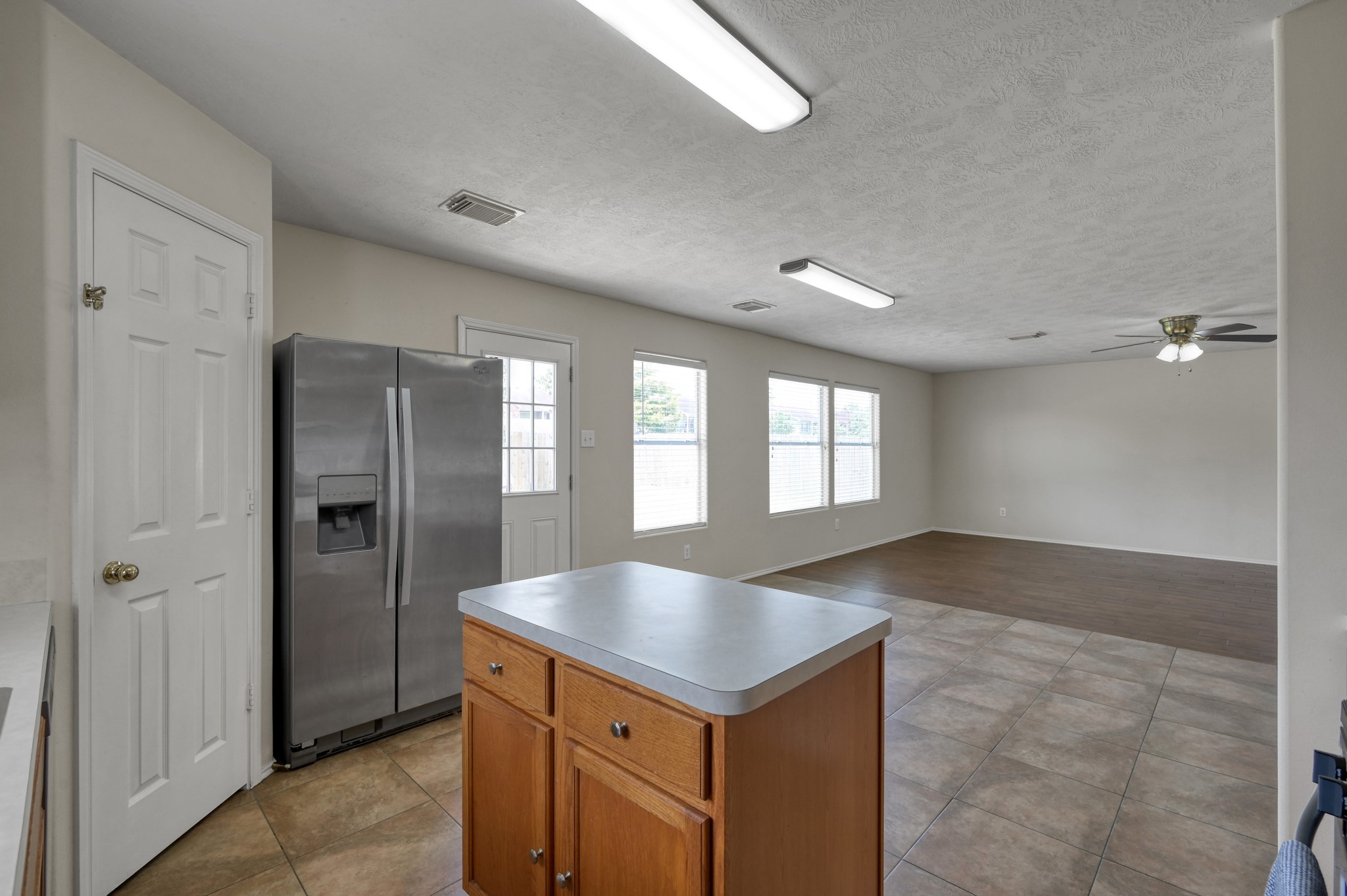 23919 Kingbriar Drive Spring, TX 77373 - Photo 17 of 33 The kitchen opens seamlessly to the living area, making meal preparation and entertaining a breeze.