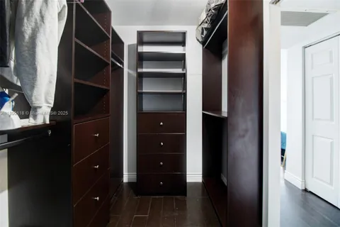 a view of closet area with empty racks