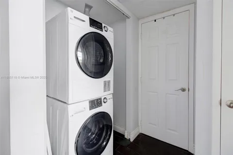 a view of bathroom with washer and dryer