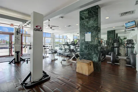 a living room with lots of furniture and wooden floor