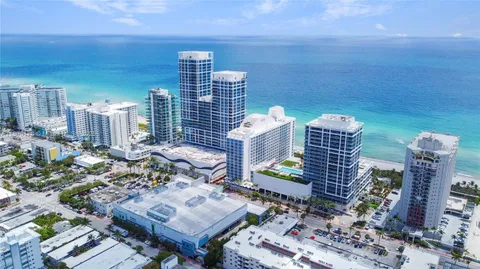 a view of city from balcony with outdoor seating