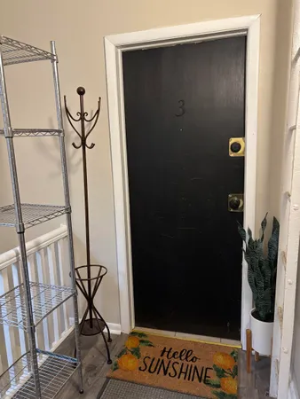 a kitchen with a stove a sink and a refrigerator