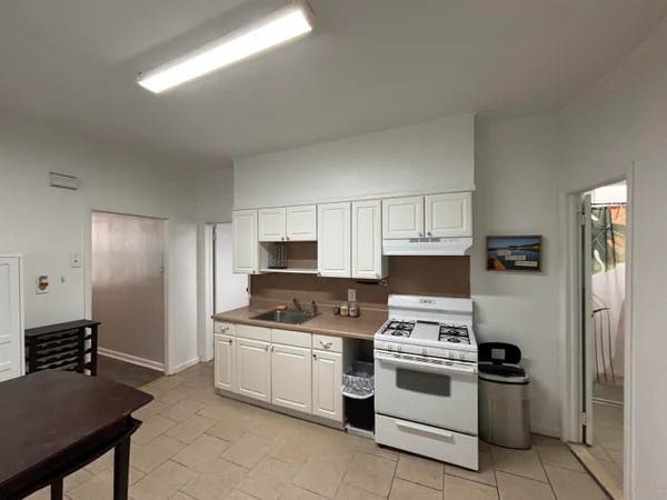 a bathroom with a sink mirror toilet and bathtub