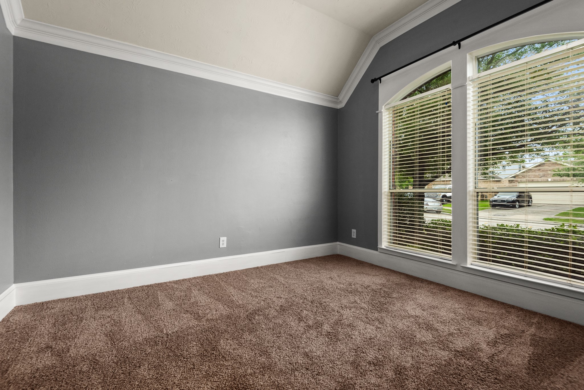 21710 Colter Stone Drive Spring, TX 77388 - Photo 7 of 35 Study/Fourth Bedroom with lovely arched windows, blinds, and glass french doors.