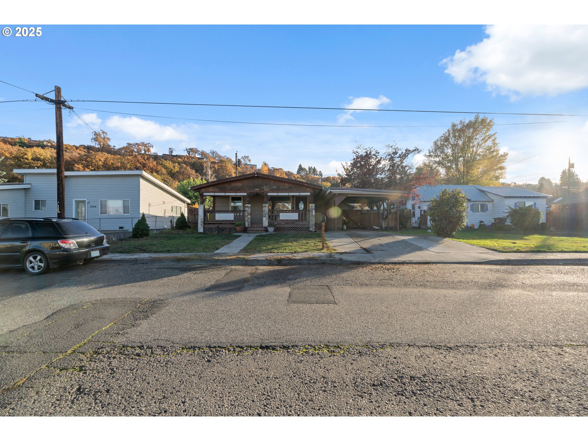 1416 East 14th Street The Dalles, OR 97058 - Photo 2 of 27 a view of a street in front of a house