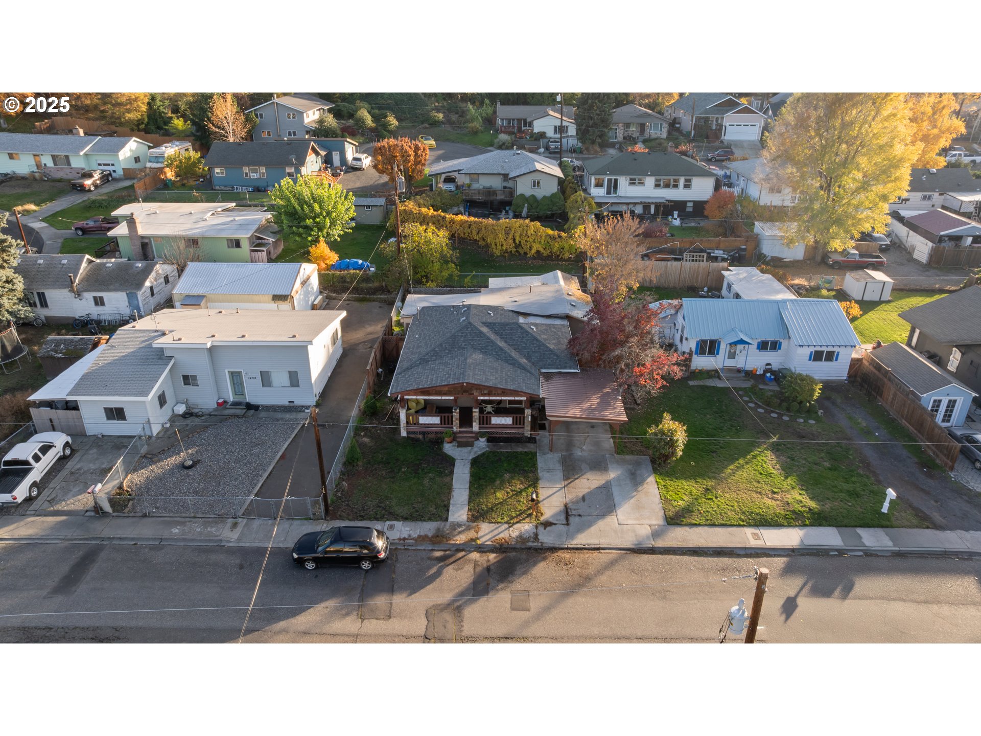 1416 East 14th Street The Dalles, OR 97058 - Photo 4 of 27 an aerial view of a houses with a swimming pool