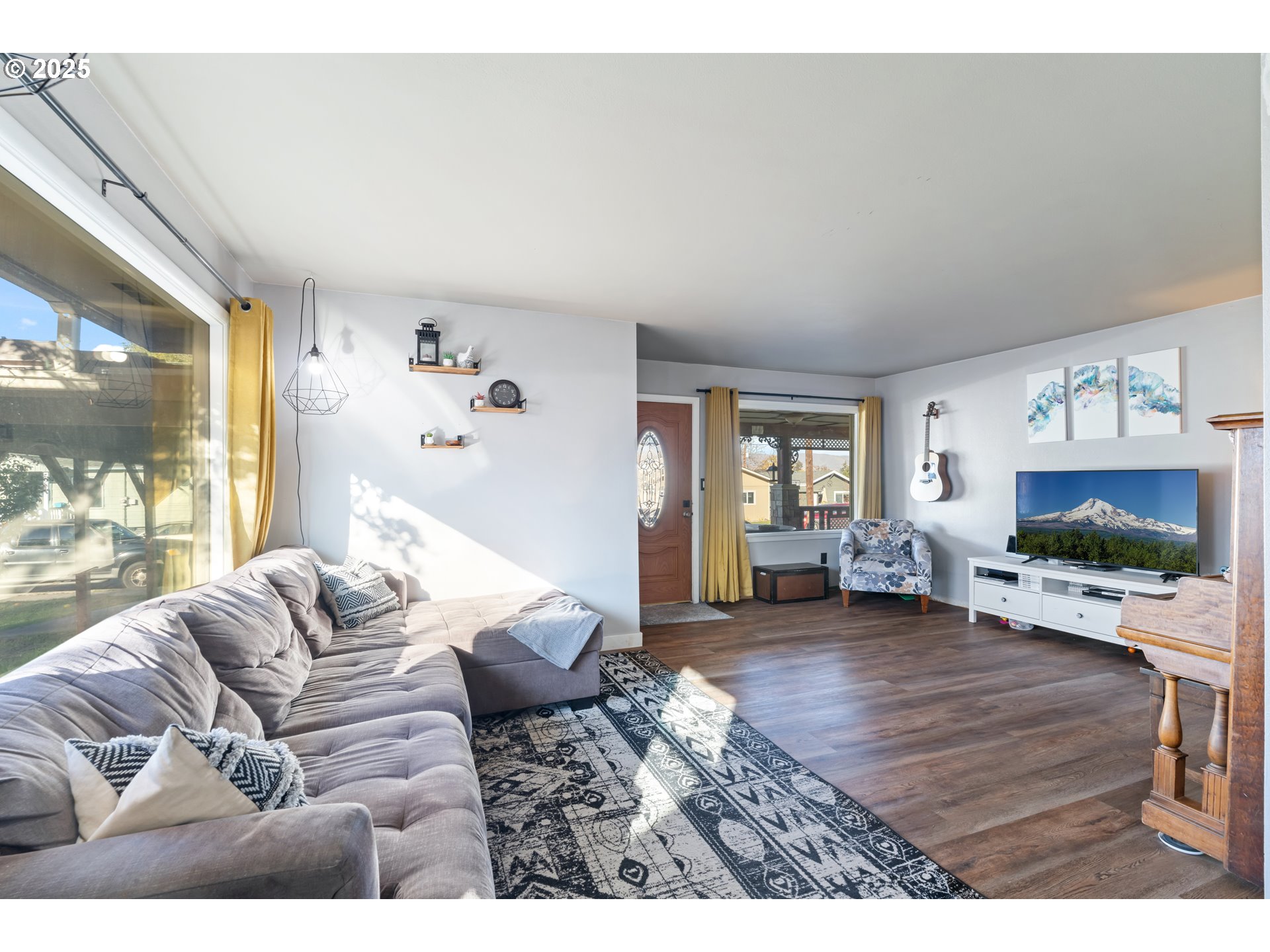 1416 East 14th Street The Dalles, OR 97058 - Photo 8 of 27 a living room with furniture and a flat screen tv