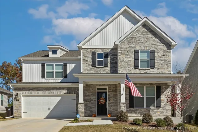 a front view of a house with yard