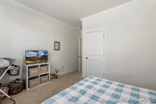 a dining room with furniture and a floor to ceiling window