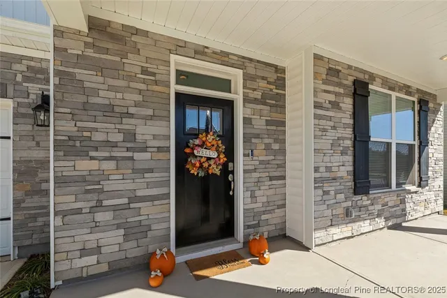 a view of a livingroom with furniture and a workspace