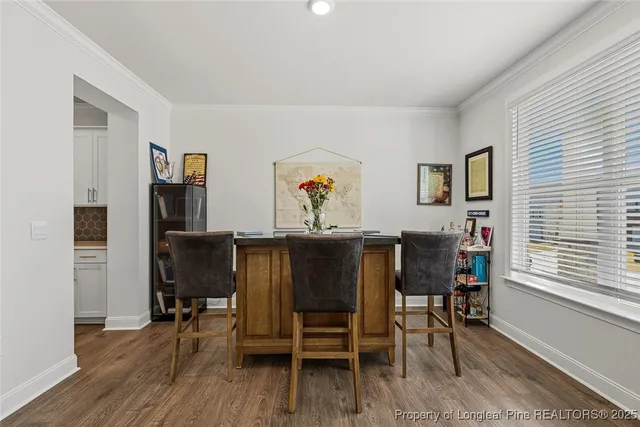 a kitchen with kitchen island white cabinets and white appliances