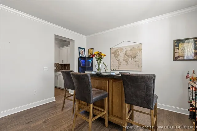a kitchen with white cabinets and appliances