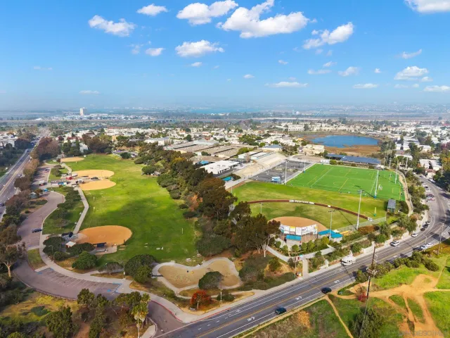 an aerial view of a residential houses with outdoor space