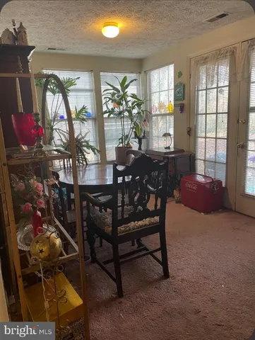 a view of a livingroom and dining room