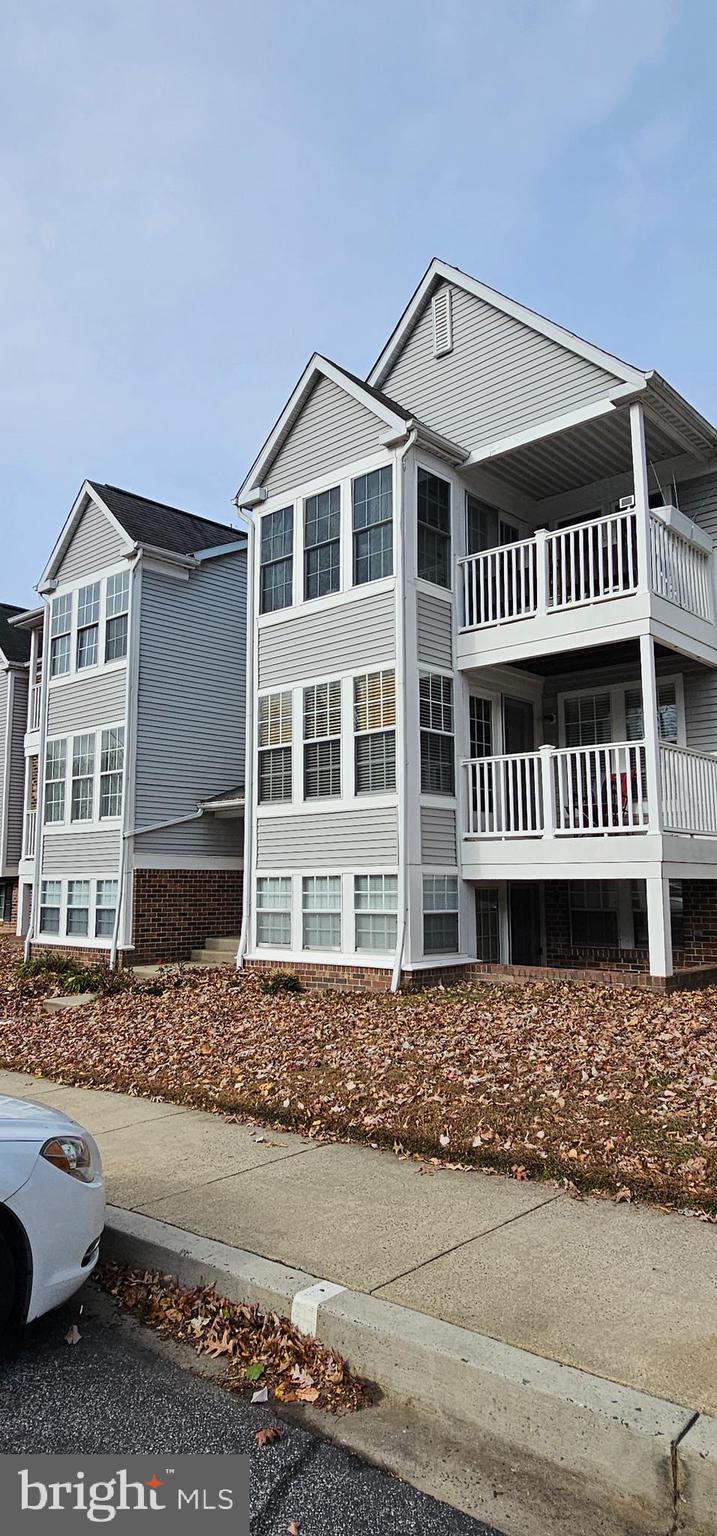 1302 Clover Valley Way, Unit 1302C Edgewood, MD 21040 - Photo 2 of 25 a front view of a house with a yard