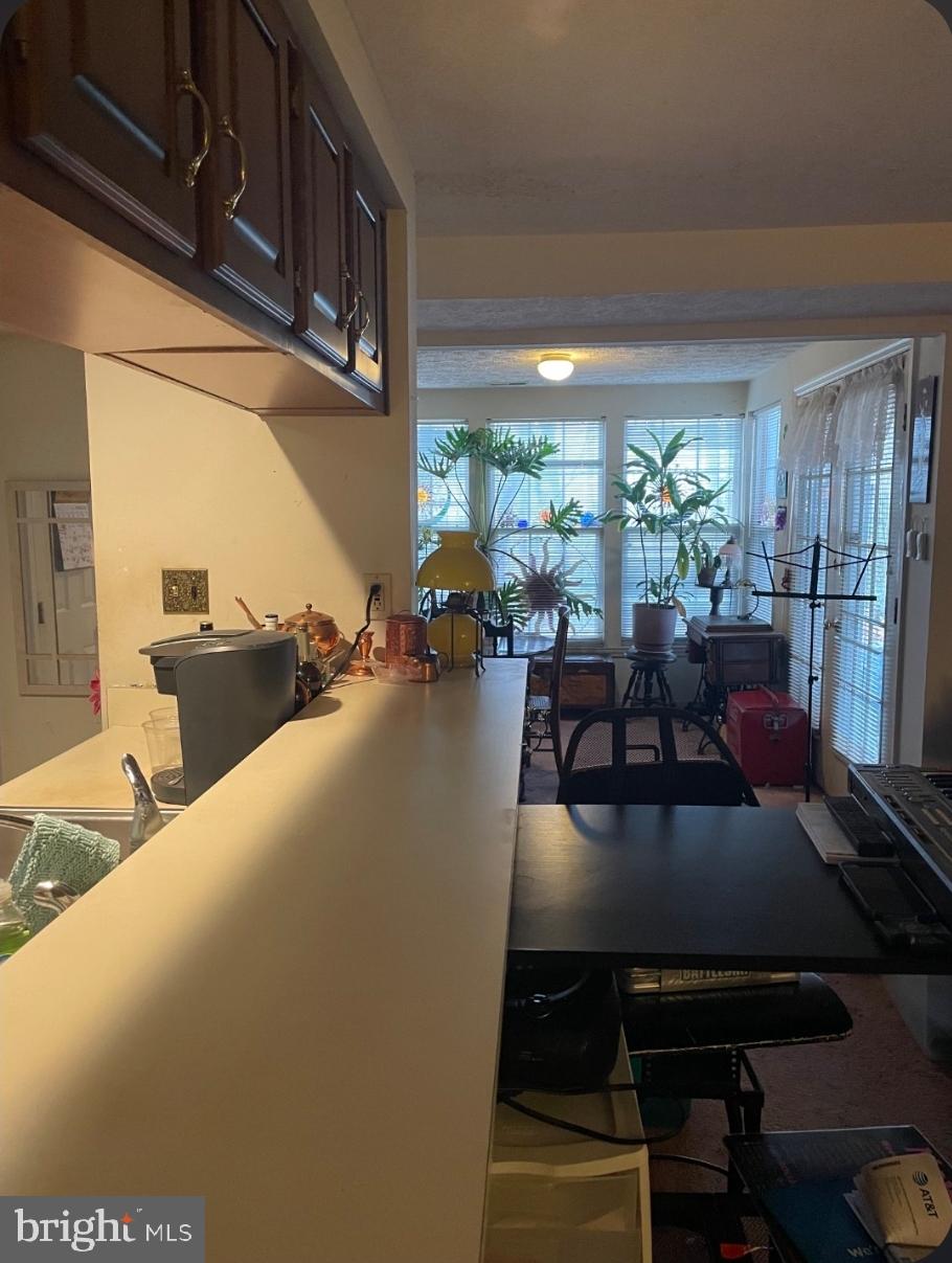 1302 Clover Valley Way, Unit 1302C Edgewood, MD 21040 - Photo 7 of 25 a living room with furniture and a large window