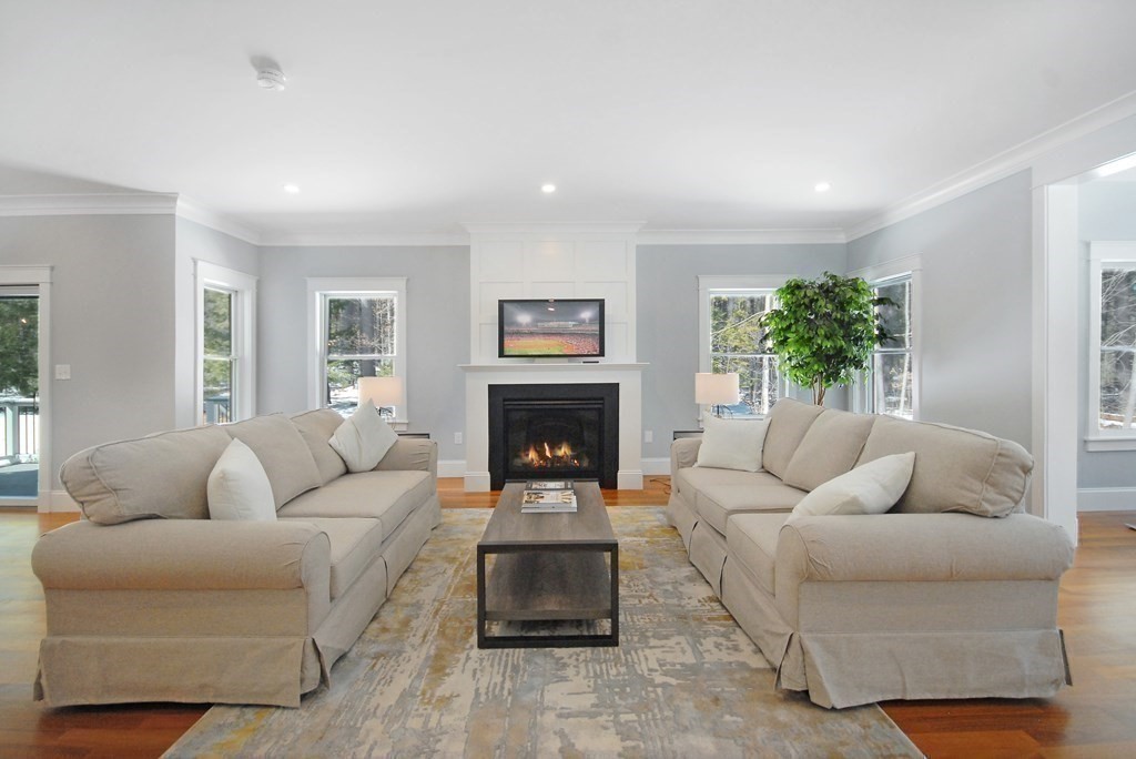 62 Pope Road Acton, MA 01720 - Photo 13 of 39 a living room with furniture and a fireplace