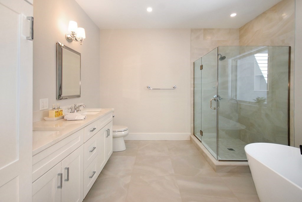 62 Pope Road Acton, MA 01720 - Photo 26 of 39 a spacious bathroom with a bathtub shower sink mirror and toilet