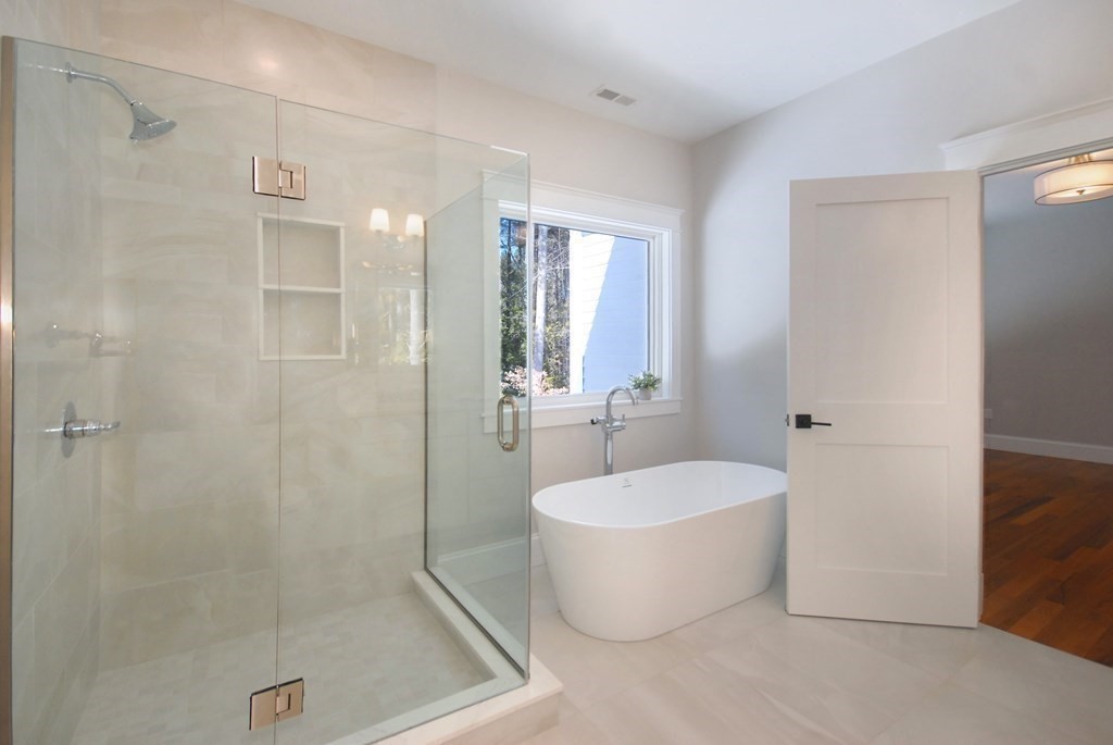 62 Pope Road Acton, MA 01720 - Photo 27 of 39 a bathroom with a bathtub and shower