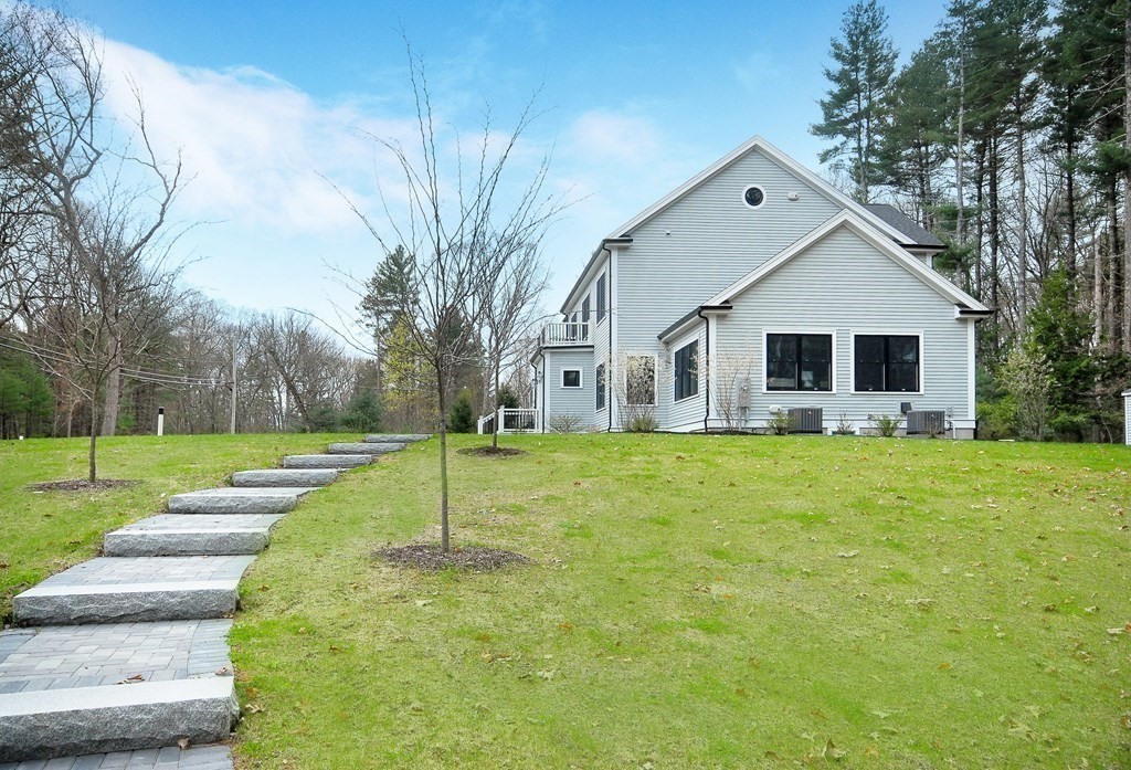 62 Pope Road Acton, MA 01720 - Photo 33 of 39 a view of house with a yard