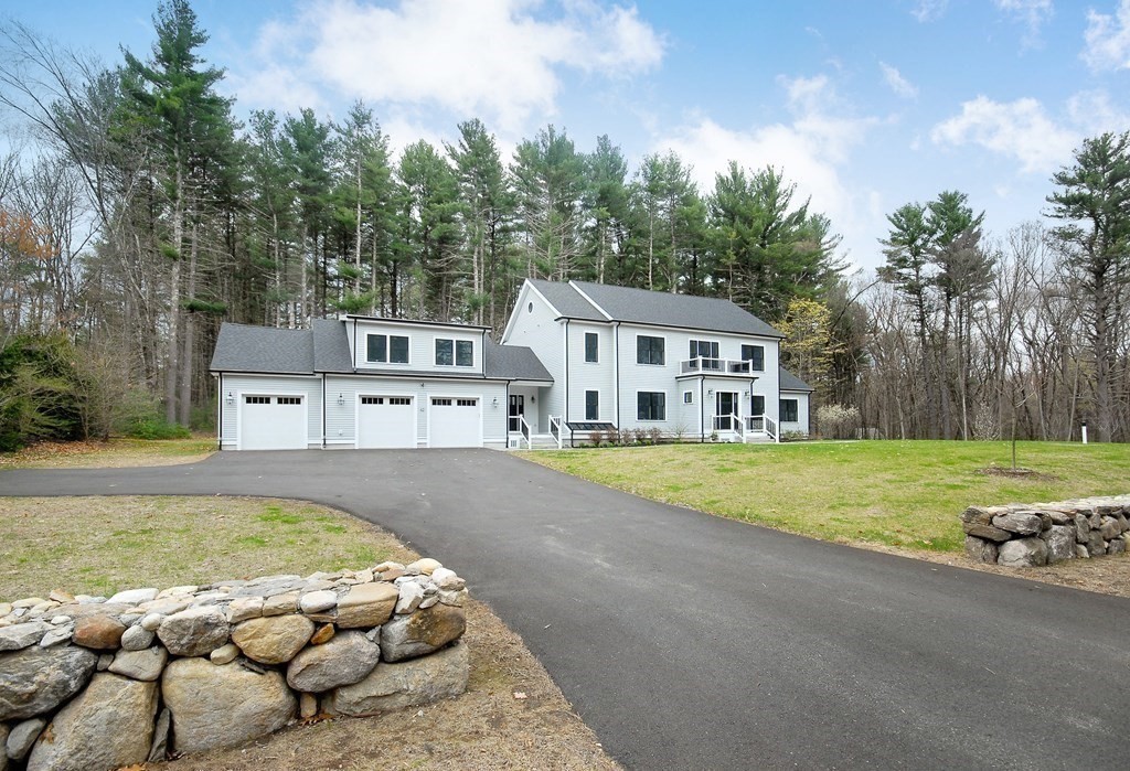 62 Pope Road Acton, MA 01720 - Photo 34 of 39 a view of a house with garden and sitting area