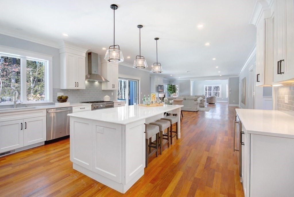 62 Pope Road Acton, MA 01720 - Photo 4 of 39 a large kitchen with stainless steel appliances granite countertop a lot of counter space and wooden floors