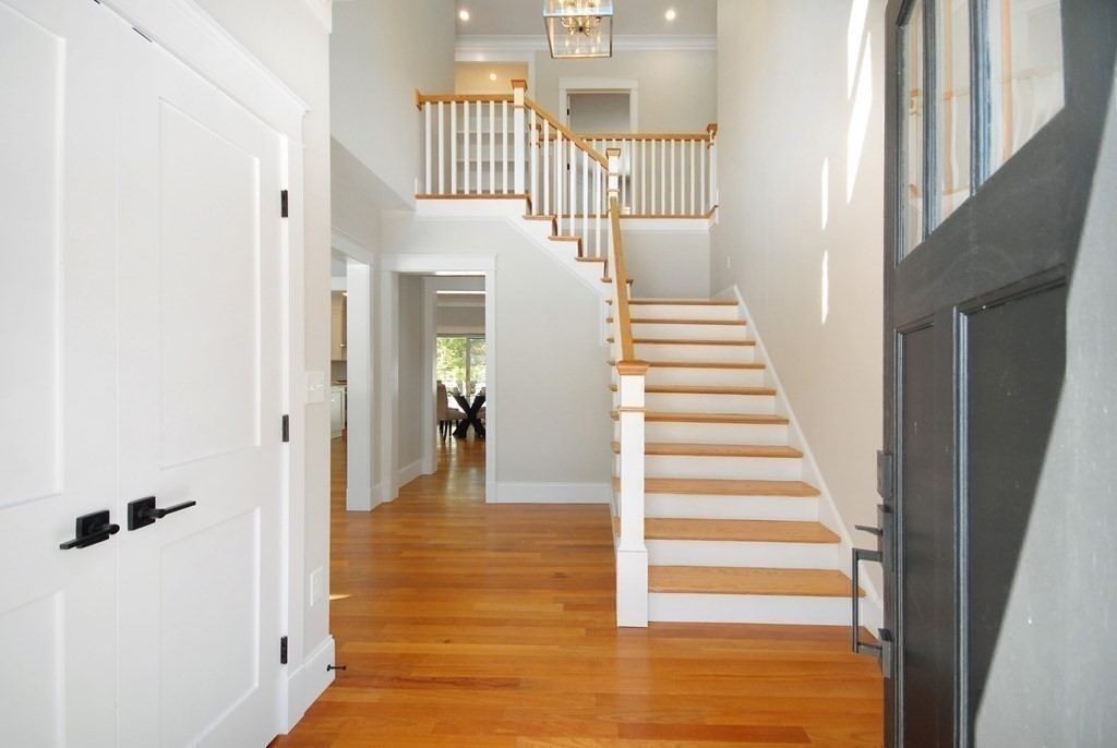 62 Pope Road Acton, MA 01720 - Photo 6 of 39 a view of a hallway with wooden floor and entryway