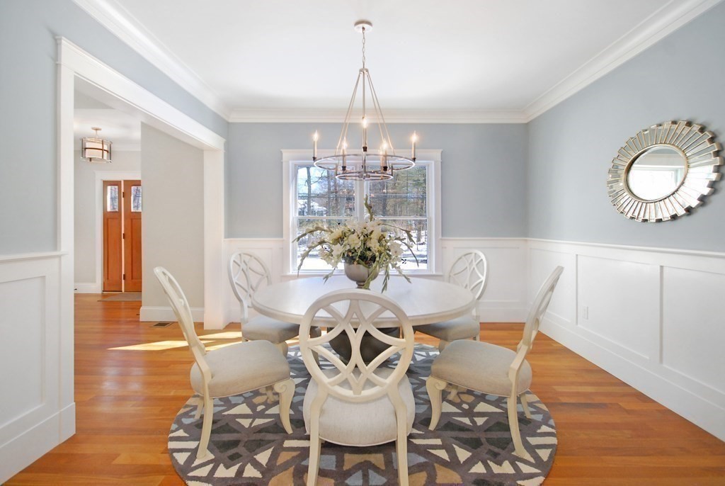 62 Pope Road Acton, MA 01720 - Photo 8 of 39 a view of a dining room with furniture a chandelier and wooden floor