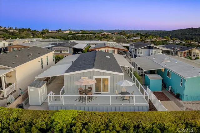 an aerial view of a house with a ocean view