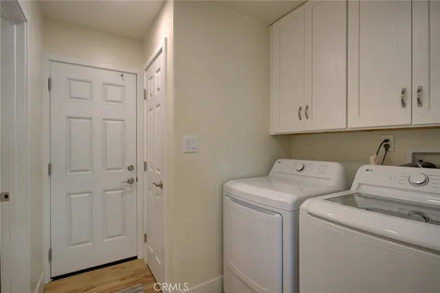 a view of storage and utility room with washer and dryer