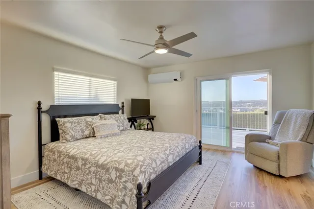 a bedroom with a large bed and a couch