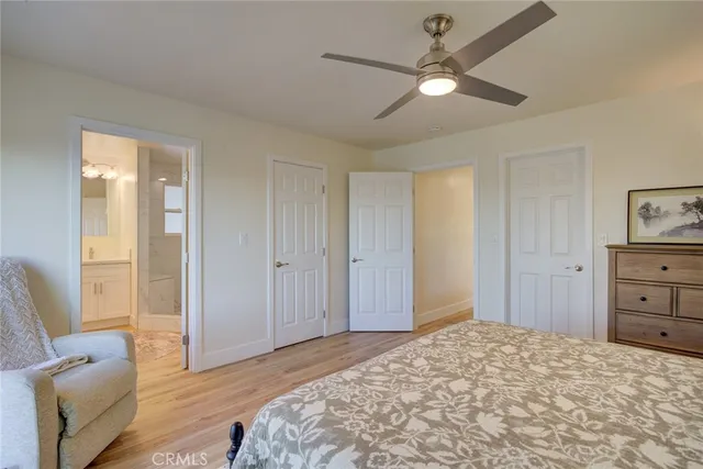 a bedroom with a bed and a couch